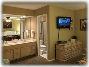 Dual sinks, 32" HDTV & DVD/VCR player in the master bedroom