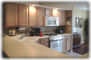 The fully stocked kitchen has a pantry cabinet for your groceries