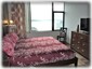 Spacious primary bedroom with comfortable king bed
