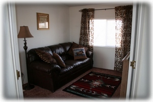 The Den off Master w/ Leather Sofa and Reading Lamp