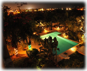Private Pool and Gardens at night