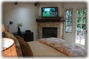 Master Bedroom with Flat Screen HDTV & a Gas Fireplace