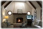 Living Room with Vaulted Beamed Ceilings and a Fireplace.