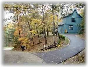 Paved Driveway has 2 Level Parking Spaces and Security Lighting