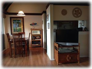Dining room area & TV cabinet w/lots of DVD's