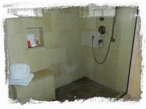 Master Bath walk-in shower with rain head and handheld showers - beautiful stone