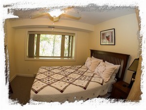 Queen sized bed w/ picture window river view