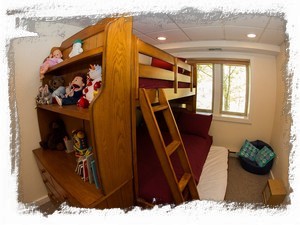 Full / twin bunk with twin trundle. Many games, books, puppets, and toys
