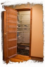 Spacious pantry with plastic bins to store your food.