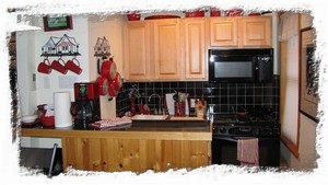Third floor kitchen. Complete with JenAir stove/grill, dishwasher + mini fridge