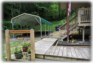 Front Of Cabin With New Carport & Dedicated Grilling Area