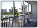 Lanai off the bedroom and living room with view of the yacht basin