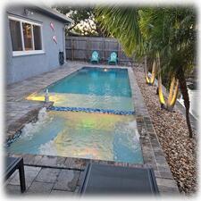 Tranquil View of Pool Deck & Canal from Inside & Outside