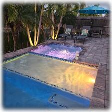 Elegant Landscape Lighting & Solar Tiki Torches Also Activate at Dusk