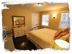 Master Bedroom has Shabby Chic Feel with Lots of Light as Well