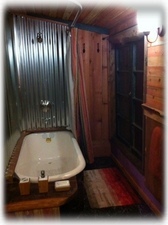Bath and shower with forest views (night photo)