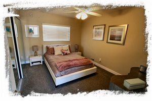 2nd bedroom furnished with Sealy Posturepedic queen bed