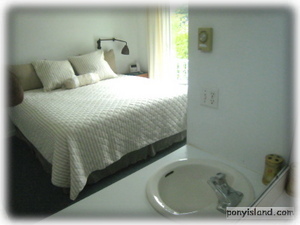  Master king bedroom with sink and vanity at The Pony House