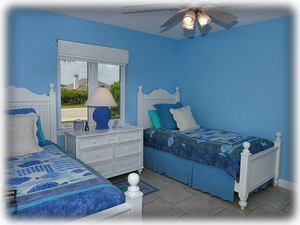 Blue bedroom with two twins