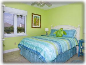 Green bedroom with queen bed