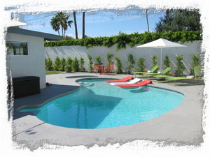 Pool area has large deck with several lounges and cabana with built in bar unit