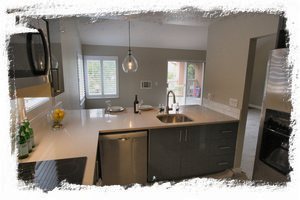 Kitchen features stainless steel appliances and new cooktop/stove