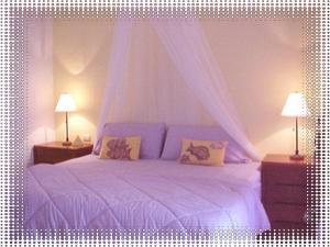 Romantic king size bed in the spacious bedroom