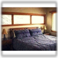 Bdrm 1 of 4 ~ This bdrm features a king-size bed and lovely mountain view