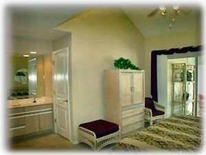 View of Master Bedroom with King Bed, dual sinks, skylight whirlpool shower/tub
