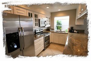 Kitchen has all stainless steel appliances and plenty of cabinet & counter space