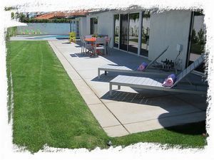 Large patio space has ample areas to entertain and relax